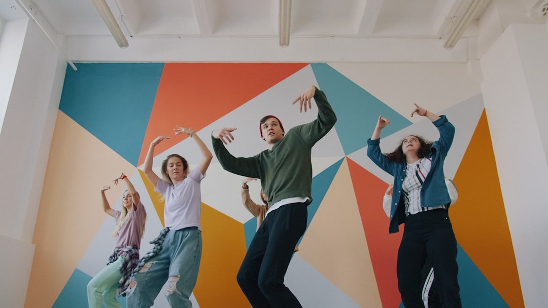 Group of television production students celebrating together in a studio