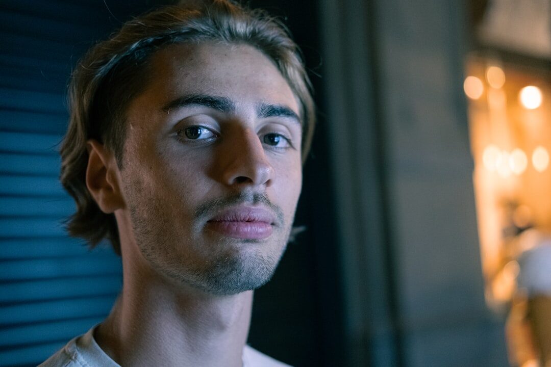 Studio portrait of a young Italian man, video switching technician