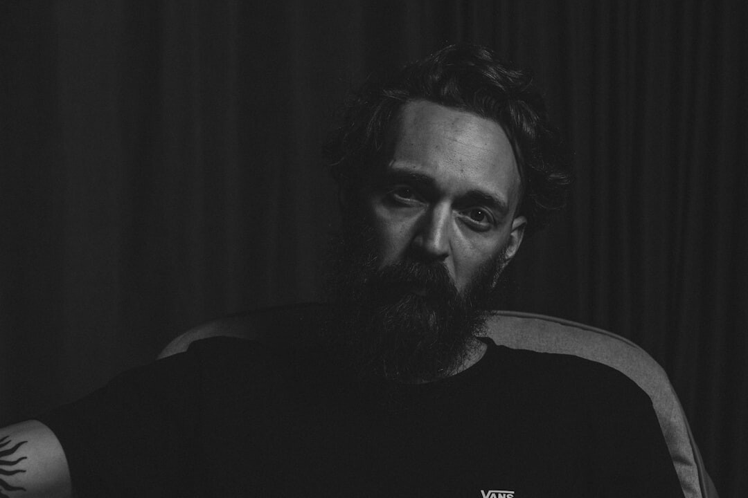 Studio portrait of an Italian man with a beard, television director